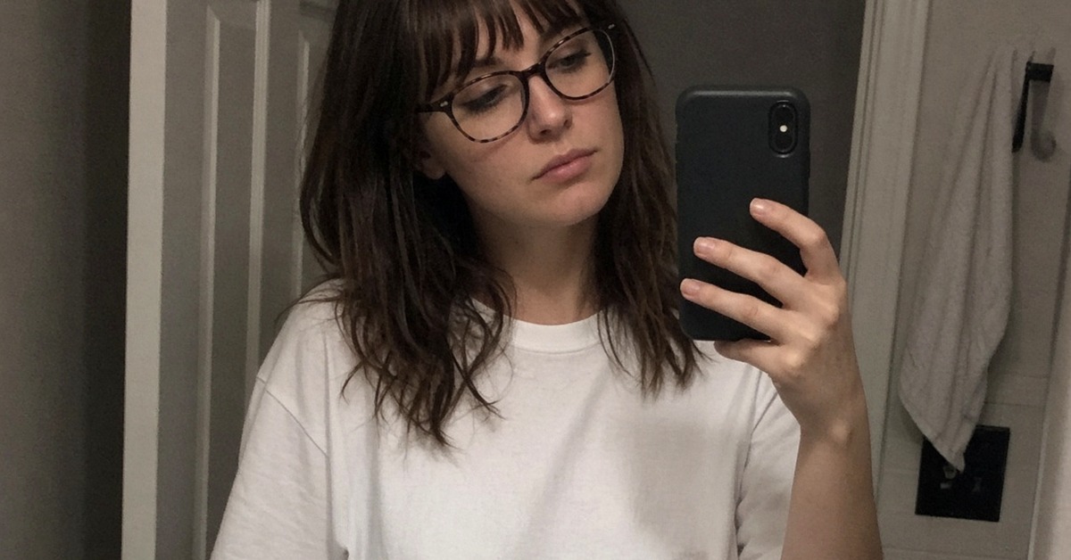 Casual photo of a woman with glasses — gamer dating vibe